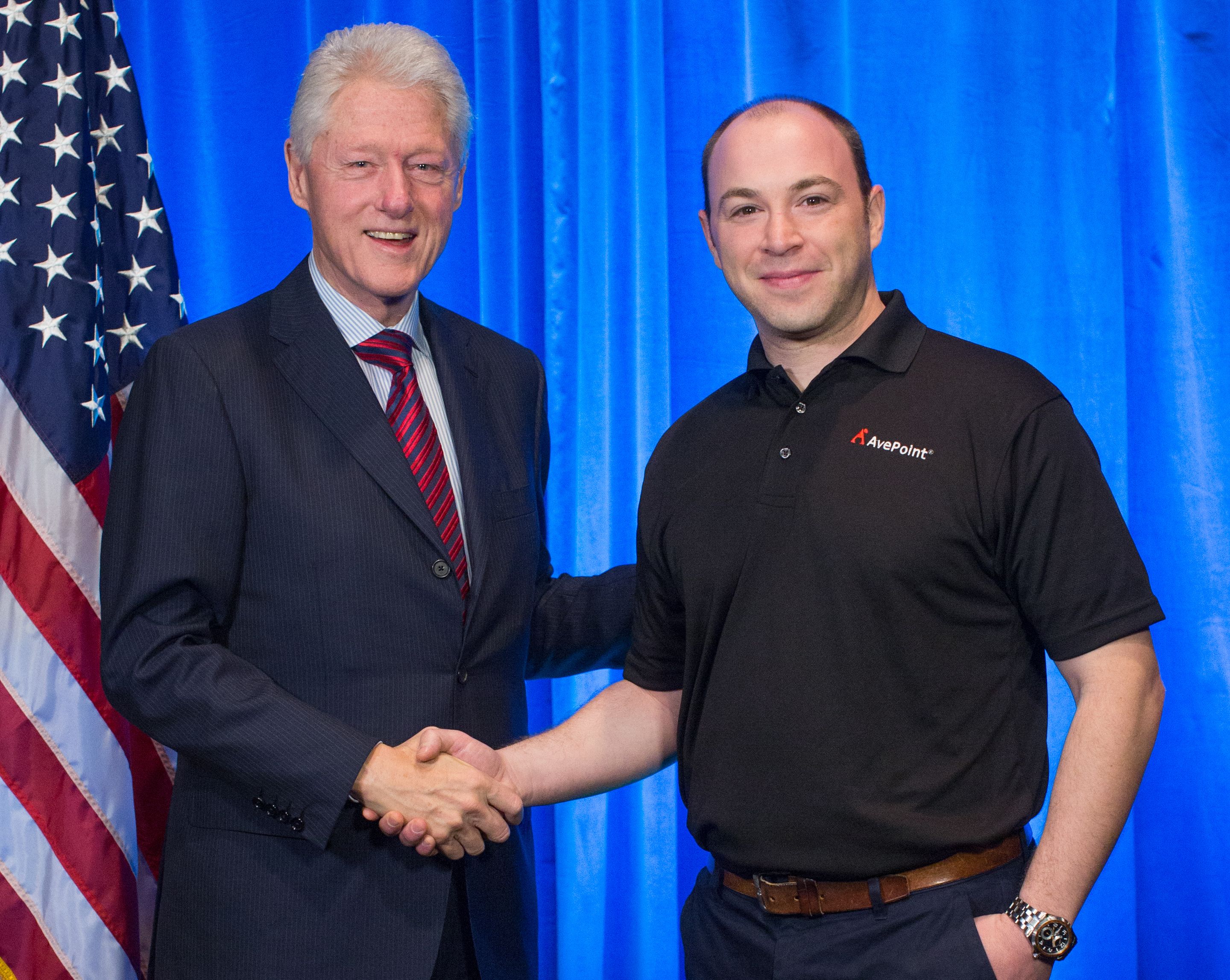 Paul Olenick (right) poses with former United States President Bill Clinton at SharePoint Conference 2014.