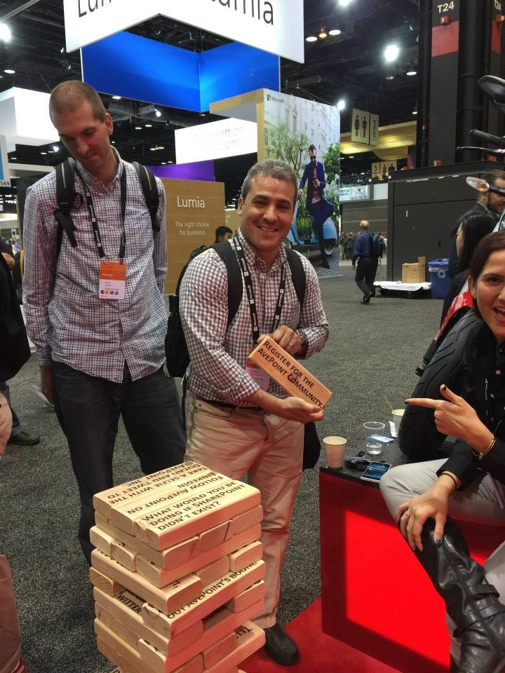 Microsoft Ignite attendees stopping to play giant Jenga at the AvePoint booth.