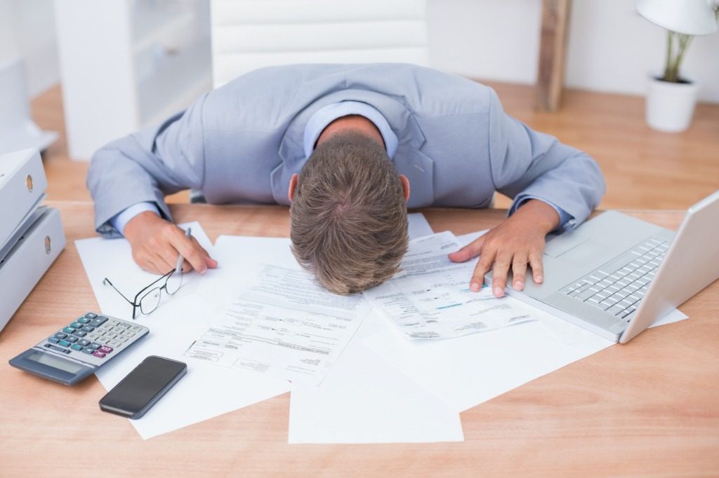 businessman being depressed by accounting picture id690496350