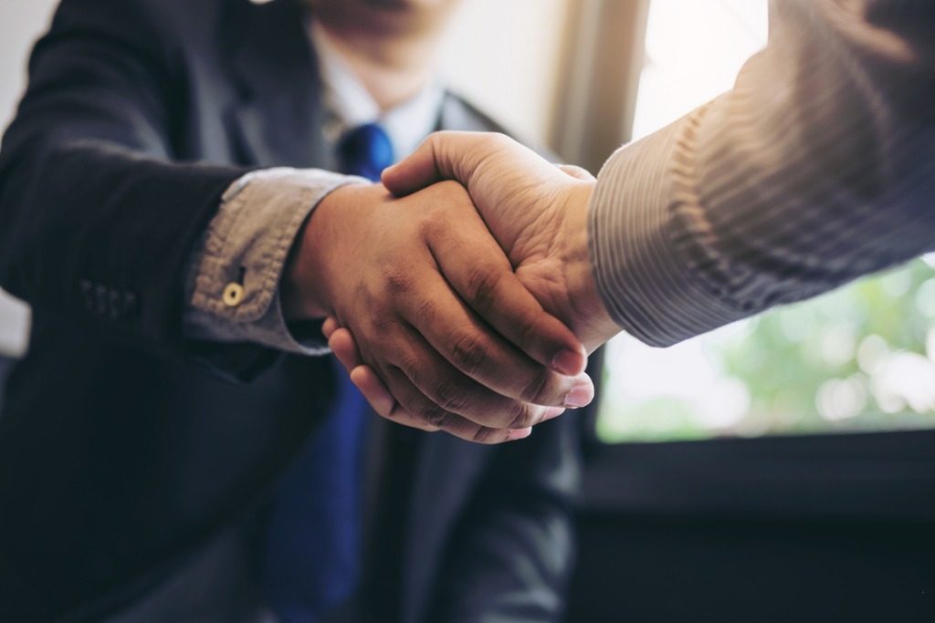 two business men shaking hands during a meeting to sign agreement and picture id886031704 1