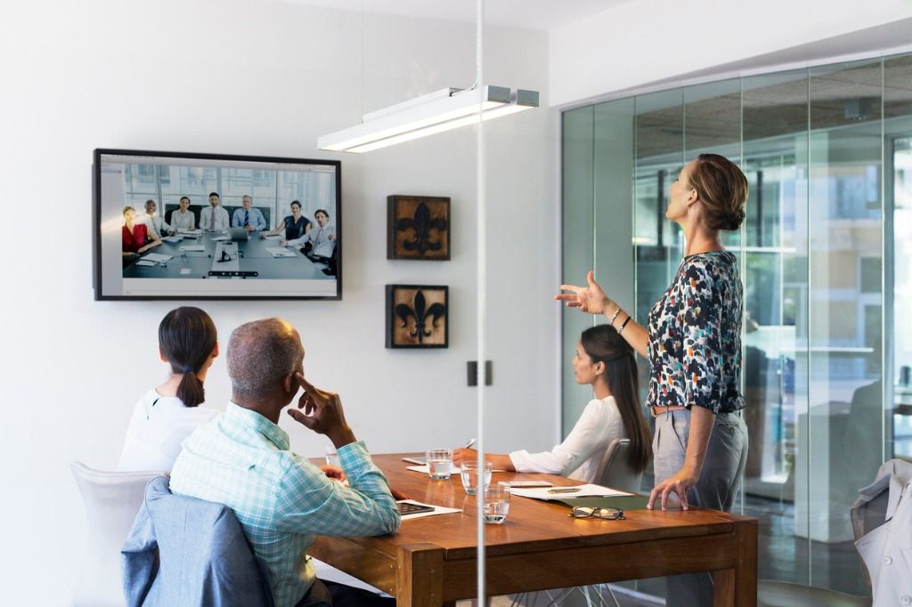 business people video conferencing in board room picture id555250357