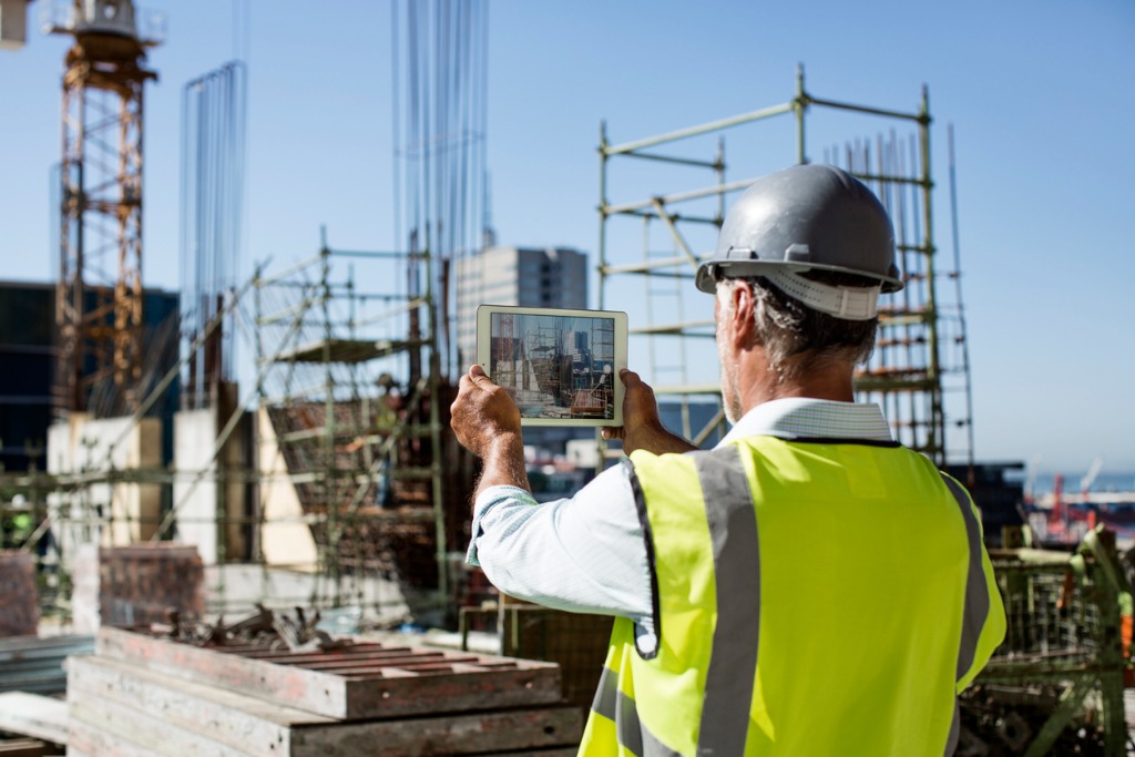 male architect photographing construction site picture id552721763