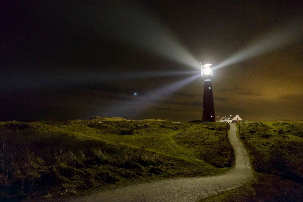 path to the lighthouse in the dunes at night picture id636209242