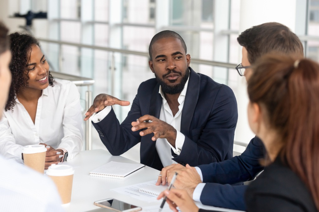 black millennial boss leading corporate team during briefing in picture id1139630453