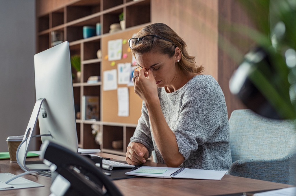 business woman having headache at office picture id1059661102