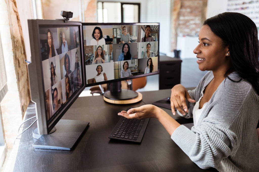 during covid19 attractive woman gestures during virtual meeting with picture id1293927641