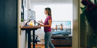 woman at standing desk on video call