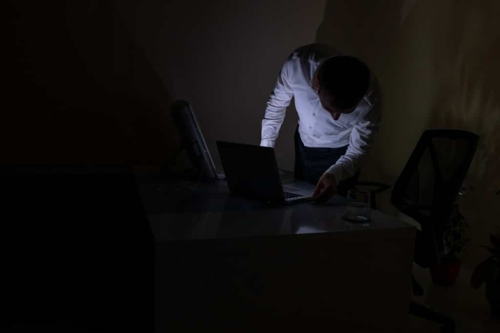 office worker preparing laptop after power cut picture id1357847920